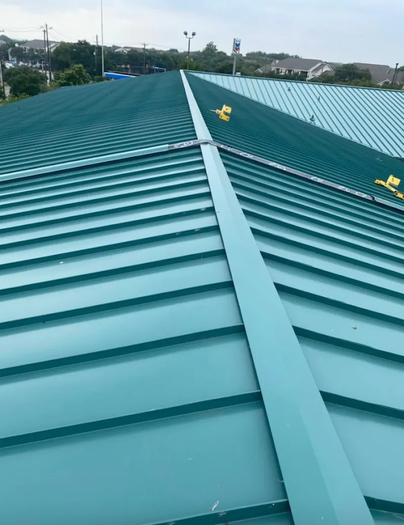 Green commercial metal roof ridge and valley for Metal Roof Repair in Westgate